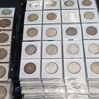 display of coins in booklet